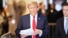 Tabloid publisher says he killed stories to help Trump politically