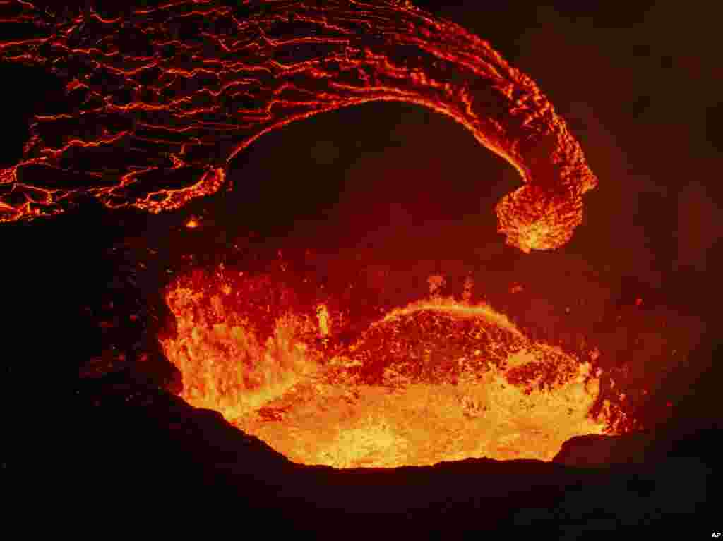 The only active crater with the lava flow emerging at it’s base in the background near the town of Grindavik, Iceland, April 6, 2024.