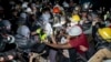 Police advance on pro-Palestinian demonstrators on the UCLA campus Thursday, May 2, 2024, in Los Angeles. (AP Photo/Ethan Swope)