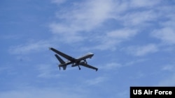FILE - A US Air Force MQ-9 Reaper assigned to the 49th Wing flies over Marine Corps Air Station Kaneohe Bay, Hawaii, during Rim of the Pacific (RIMPAC) 2022.