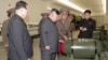Tangkapan layar menunjukkan pemimpin Korea Utara Kim Jong Un sedang memeriksa hulu ledak nuklir di lokasi yang dirahasiakan dalam video yang dirilis oleh KCNA pada 28 Maret 2023. (KRT/Handout via Reuters)