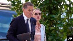 Hunter Biden, left, arrives with his wife, Melissa Cohen Biden, at federal court in Wilmington, Delaware, June 4, 2024.