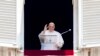 FILE - Pope Francis delivers his blessing as he recites the Angelus noon prayer from the window of his studio overlooking St. Peter's Square, at the Vatican, June 18, 2023. 