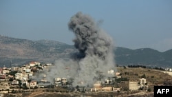 Smoke billows from the site of an Israeli airstrike on the southern Lebanese village of Khiam near the border on June 8, 2024, amid ongoing cross-border tensions as fighting continues between Israel and Hamas militants in the Gaza Strip.