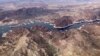 FILE - In this aerial photo, a bathtub ring of light minerals show the high water mark on the shore of Lake Mead along the border of Nevada and Arizona, Monday, March 6, 2023, near Boulder City, Nevada.