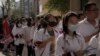 FILE - Students line up for their first day of China's national college entrance examinations, known as the gaokao, in Beijing, June 7, 2023. 