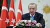 In this handout photo released by Turkish Presidency, President Recep Tayyip Erdogan inaugurates Turkey's first nuclear power plant via a video link, in Ankara, April 27, 2023.