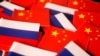 Bendera China dan Rusia dalam sebuah ilustrasi. China berharap akan ada solusi damai bagi konflik di Ukraina serta mendesak Rusia dan Ukraina agar merundingkan perdamaian. (Foto: REUTERS/Florence Lo)