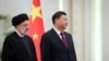 Iranian President Ebrahim Raisi stands next to Chinese President Xi Jinping during a welcoming ceremony in Beijing, China, Feb. 14, 2023. (West Asia News Agency/Handout via Reuters)