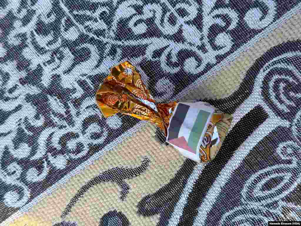 Salem, with his young son Mohamed, says, “This Eid, I bought a Palestinian flag for my son, because we shouldn’t forget about our Palestinian brothers as we celebrate.” Abusir, Egypt, April 10, 2024.