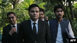 Naeem Haider Panjutha, center, spokesperson for former Pakistan's Prime Minister Imran Khan on legal affairs, arrives for a media briefing in Islamabad on Aug. 7, 2023, after meeting with Khan in Attock Jail.