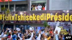 FILE - Democratic Republic of Congo President Felix Tshisekedi, with first lady Denise Nyakero at his side, greets supporters after the announcement of election results at QG Fatshi 20, the headquarters of his reelection campaign, in Gombe, Dec 31, 2023.