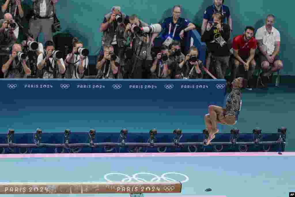 Simone Biles of United States performs on the beam during a women's artistic gymnastics qualification round at the 2024 Summer Olympics in Paris, France.