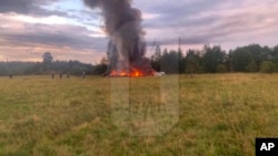 This image released and watermarked by Ostorozhno Novosti on Aug. 23, 2023, shows the crash site of a private jet near the village of Kuzhenkino, Tver Region. Officials say a private jet has crashed over Russia, killing all 10 people on board.