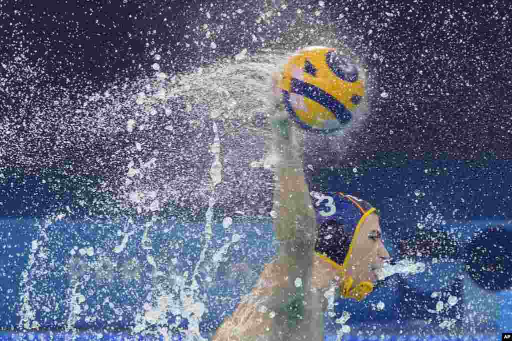 Spain's Alvaro Granados Ortega shoots to score during a men's water polo Group B preliminary match between Serbia and Spain at the 2024 Summer Olympics in Saint-Denis, France.