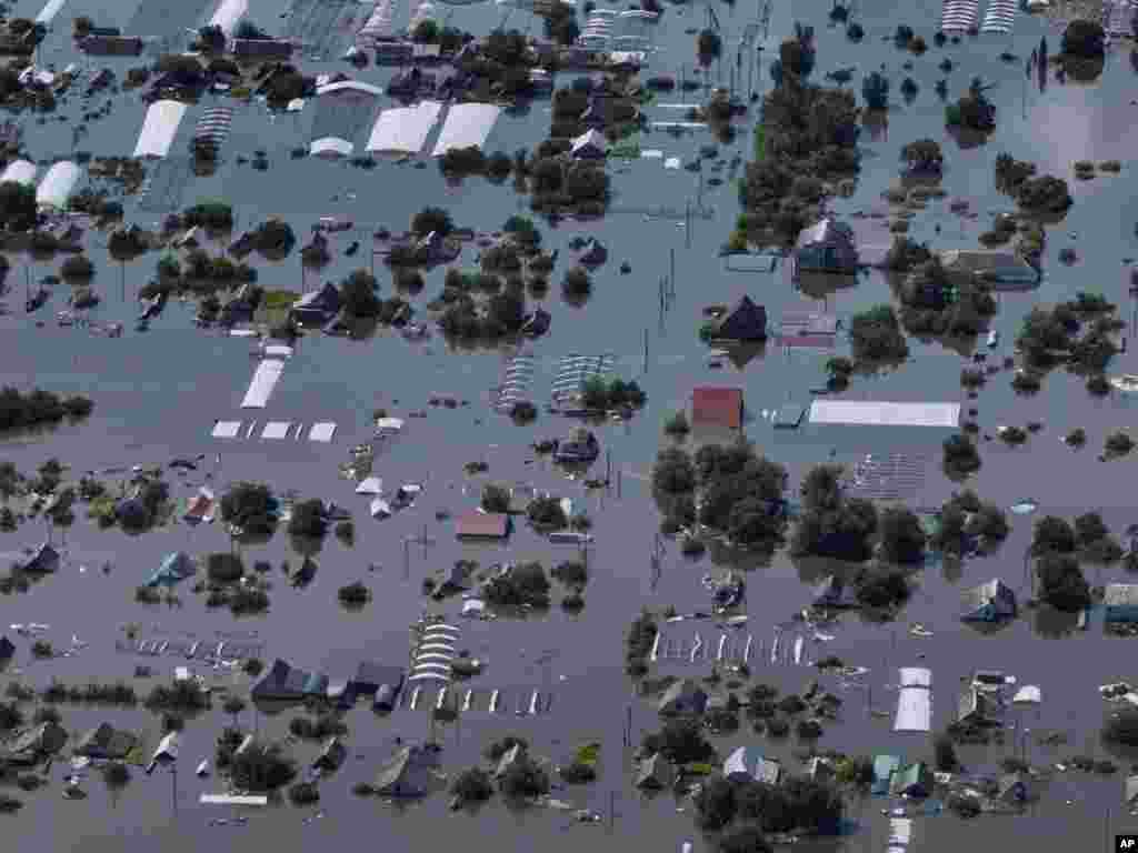 Houses are seen underwater in the flooded village of Dnipryany, in Russian-occupied Ukraine, June 7, 2023, after the collapse of Kakhovka Dam.