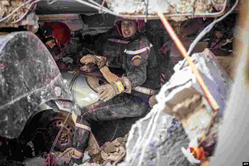 Rescue workers search for survivors in a collapsed house in Moulay Brahim, Al Haouz province, Morocco, on Sept. 9, 2023, after an earthquake.