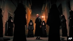 This image released by Warner Bros. Pictures shows Taissa Farmiga as Sister Irene in New Line Cinema's horror thriller "The Nun II." (Warner Bros. Pictures via AP)