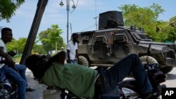 Police patrol in an armored vehicle in the Champ de Mars area of Port-au-Prince, Haiti, April 24, 2024.