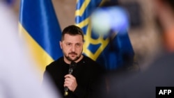 FILE - Ukraine's President Volodymyr Zelenskyy meets with international media in Riga, Latvia, Jan. 11, 2024.