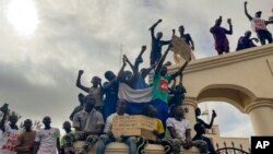 Supporters of Niger's ruling junta gather at the start of a protest called to fight for the country's freedom and push back against foreign interference in Niamey, Niger, Aug. 3, 2023.