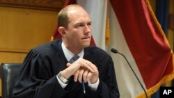 Fulton County (Ga.) Judge Scott McAfee addresses lawyers in the election interference case against former President Donald Trump, March 28, 2024, in Atlanta. Trump on March 29 sought a reversal of McAfee's ruling that let the Fulton district attorney stay on the case.