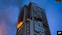 A multi-story apartment building is damaged during Russian attack in Kyiv, Ukraine, June 24, 2023.