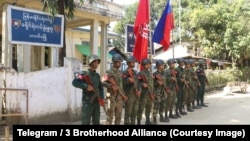 Fighters of the Arakan Army are seen outside a police station in Paletwa, Chin state, Jan. 14, 2024, after the ethnic armed group seized the township.