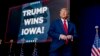 Republican presidential candidate and former President Donald Trump takes the stage at a caucus night party in Des Moines, Iowa, Jan. 15, 2024.