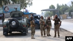 FILE - Taliban security personnel stand guard at the Pakistan-Afghanistan border in Torkham, Afghanistan, on Sept. 15, 2023. 