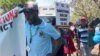 FILE - Zimbabweans protest Western sanctions on the nation's leaders, in Harare, Oct. 25, 2023. (Columbus Mavhunga/VOA)