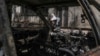 A Palestinian woman sits outside her torched home, days after it was set on fire by Jewish settlers, in the West Bank town of Turmus Ayya, June 24, 2023. 