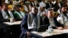 South African President Cyril Ramaphosa, first row left, listens in Johannesburg, Jan. 26, 2024 to the ruling from the top U.N. court that harshly criticized Israel's war against Hamas. 