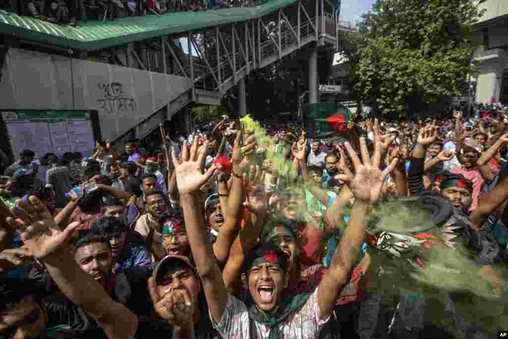 Protesters shout slogans as they celebrate Prime Minister Sheikh Hasina's resignation, in Dhaka, Bangladesh.