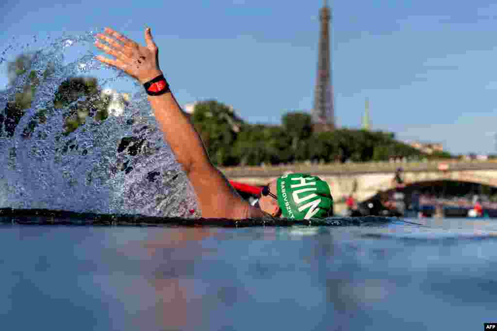 Hungary's Kristof Rasovszky backstrokes through the Seine during the men's 10-kilometer marathon swimming final at the Paris 2024 Olympic Games at Pont Alexandre III in Paris.