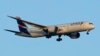 FILE - A LATAM Airlines Boeing 787 approaches for landing in Lisbon at sunrise, July 5, 2023. 