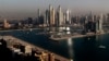 FILE: Luxury towers dominate the skyline in the Dubai Marina district, center, and the new Dubai Harbor development, right, as seen from the observation deck of "The View at The Palm Jumeirah" in Dubai, United Arab Emirates, on April 6, 2021. 