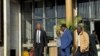 Attorney Alec Muchadehama, black suit, and Tendai Biti, blue suit, leave the Harare court on Feb. 27, 2024. 
