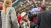 Jackie Garlock of Clear Lake, Iowa, wears a white hat indicating her status as one of Donald Trump's "caucus captains" while attending his rally in Mason City, Iowa, Jan. 5, 2024. 