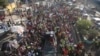 FILE - Factory workers march to demand salary increases in Port-au-Prince, Haiti, May 9, 2023.