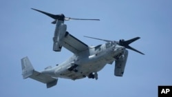 FILE - A U.S. MV-22B Osprey transport aircraft flies back to the U.S. Marine Corps Air Station Futenma in Ginowan, south of Okinawa, southern Japan, Sept. 6, 2023. 
