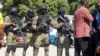 Lapolis Ayiti pran pozisyon devan katye jeneral PNH la nan Potoprens, apre arive Guy Philippe ke Etazini rapatriye 30 Nov. 2023. 