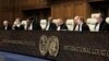 Para hakim memimpin pembukaan sidang di Mahkamah Internasional di Den Haag, Belanda, Kamis, 11 Januari 2024. (AP/Patrick Post)