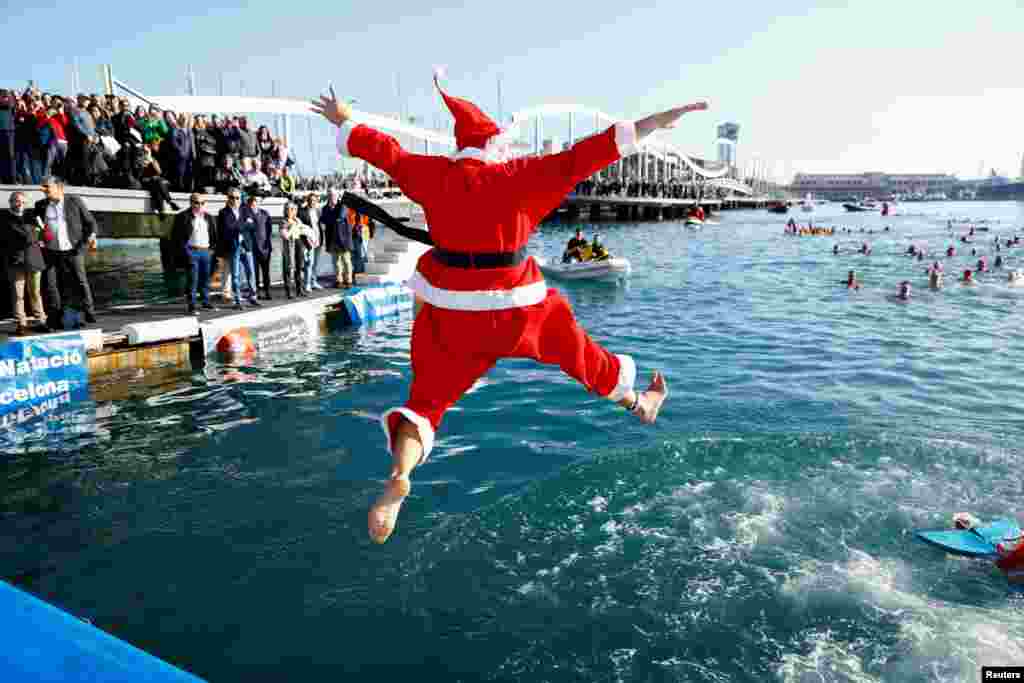 A person dressed as Santa Claus jumps into the sea during the Copa Nadal (Christmas Cup) swimming race in Barcelona, Spain, Dec. 25, 2024.