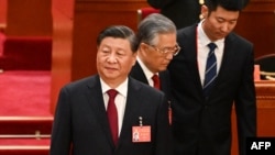 中共领导人习近平和前领导人胡锦涛在北京人大会堂出席中共二十大开幕式。（2022年10月16日）