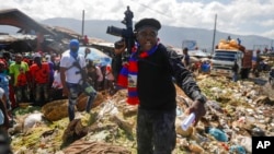 FILE - Jimmy Cherizier, known as Barbecue, the leader of the G9 and Family gang, in Port-au-Prince, Haiti, Oct. 22, 2021. Cherizier is among those targeted by U.N. sanctions in an effort to quell gang violence in Haiti.