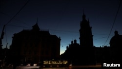 The city center of Lviv, Ukraine, is shrouded in darkness as it has no electricity after critical civil infrastructure was hit by Russian missile attacks on Oct. 10, 2022. 