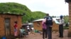 FILE - World Health Organization epidemic specialists visit a shanty town after an outbreak of the Marburg virus in Angola, April 10, 2005. Ghana recorded three cases of the virus in June 2022, but was declared free of Marburg on Sept. 16, 2022, a health official announced.