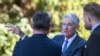 Federal Reserve Chair Jerome Powell, center, takes a coffee break with attendees of the central bank's annual symposium at Jackson Lake Lodge in Grand Teton National Park, Aug. 26, 2022. in Moran, Wyoming.