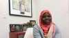 FILE - Fartun Abdi, a 25-year-old Somalian sits at work in Nashville, Tennessee, Dec. 17, 2019. 